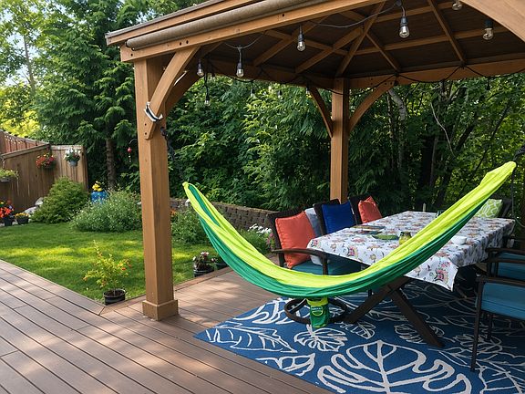 Escape to your private outdoor sanctuary, bordering a protected natural greenbelt. Take in the fresh air and chirping birds from your hammock under the gazebo, perfectly situated on a premium, low-maintenance Trex deck.