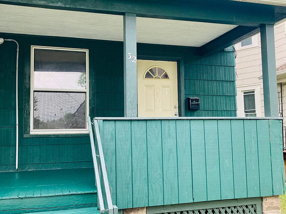 front door entry with large covered porch area