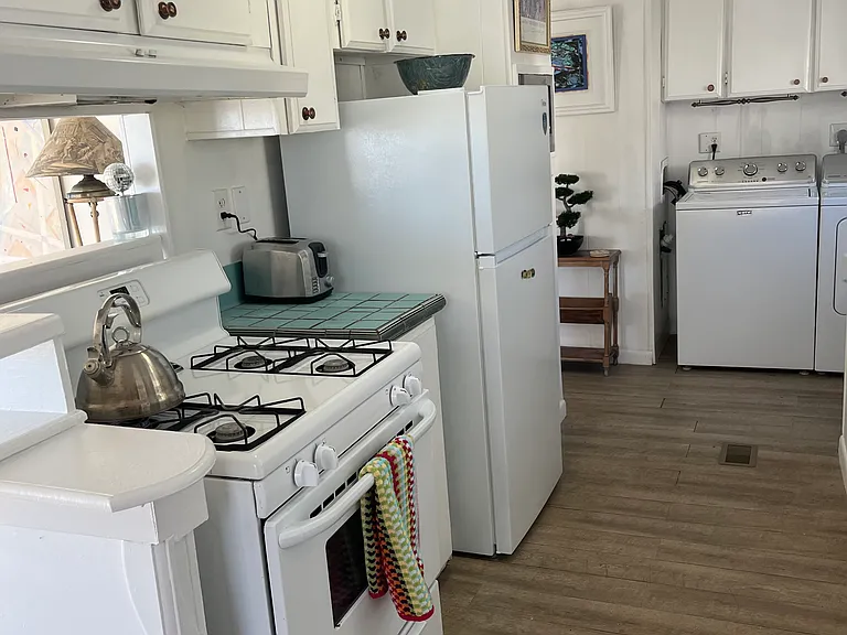 kitchen with gas stove and refrigerator