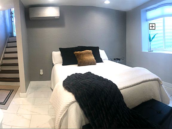 Your own personal heating and air unit, plus an electric fireplace, updown-blinds, an air purifier, an air monitor, and a weighted blanket to help you alleviate stress for a better night's sleep