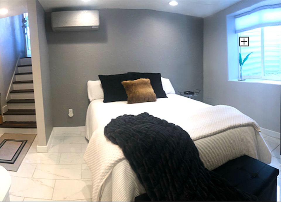 Your own personal heating and air unit, plus an electric fireplace, updown-blinds, an air purifier, an air monitor, and a weighted blanket to help you alleviate stress for a better night's sleep