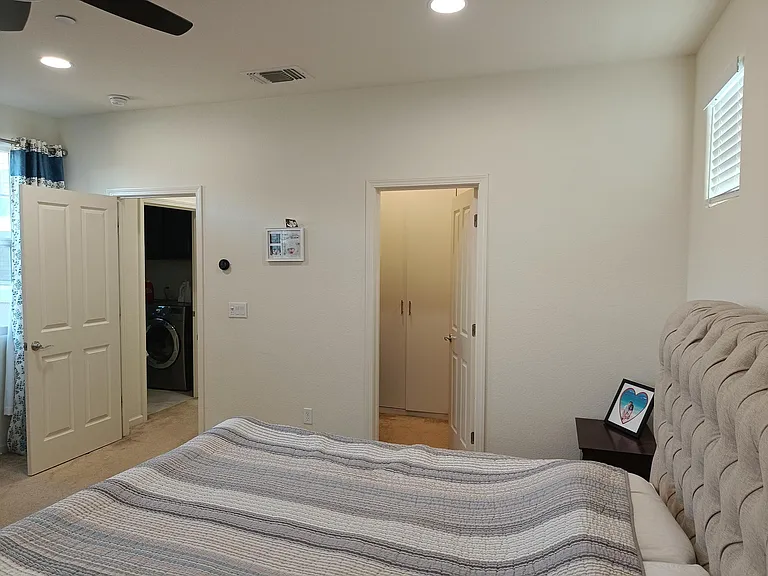 Enjoy a panoramic view from the master bed to the spacious closet adorned with cabinets. This seamless transition combines luxury and functionality, offering a private haven of organization and style. Your retreat, beautifully connected. _____