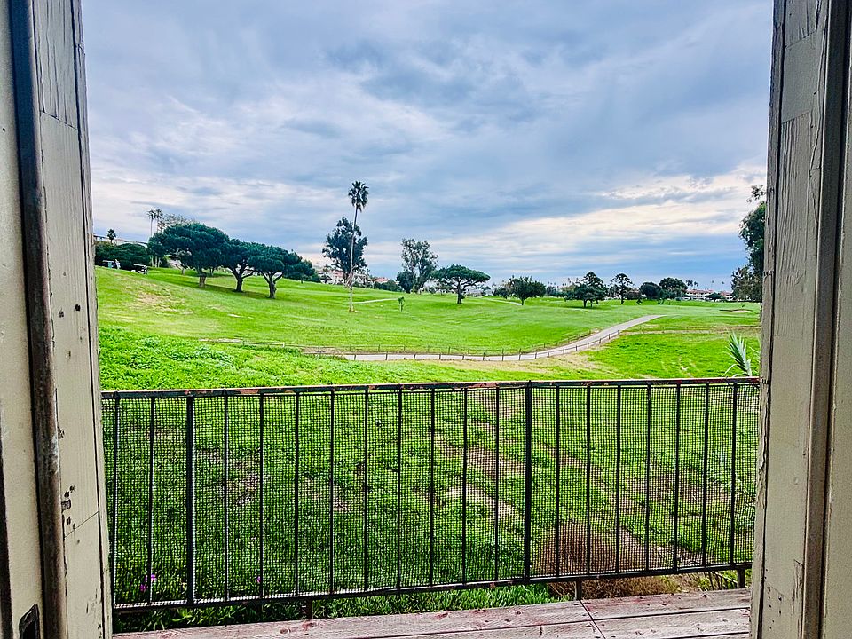 Front door view to balcony over golf course