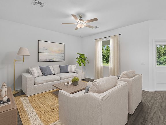 Gather with family and friends in the living room of the Bay plan