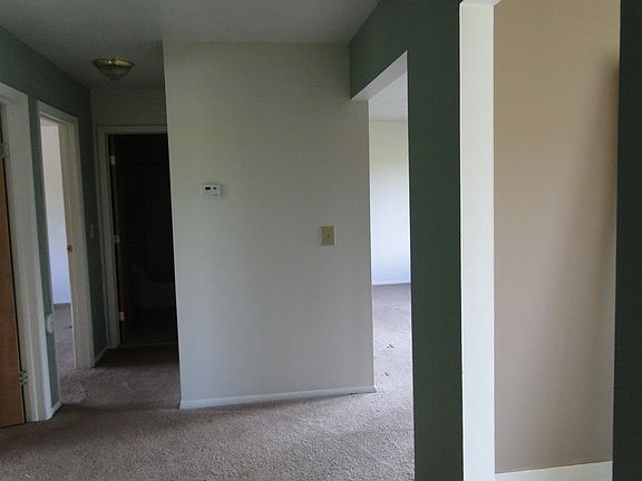 Kitchen and living room to right and bedrooms to left