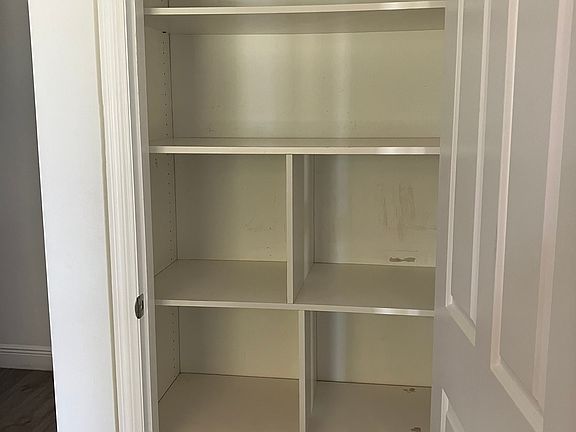 Wood shelves with dividers for great pantry organization!