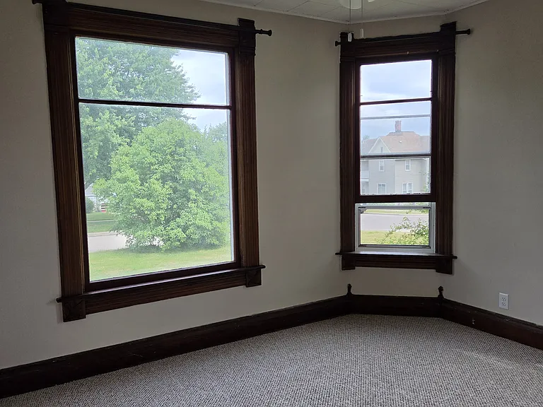 Bedroom #1 with large windows and new heavy duty curtain rods
