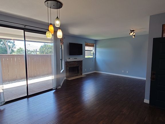 Open floor plan with living and dining room, and covered patio