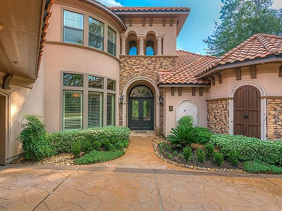 Beautiful stone and stucco elevation is further enhanced by stacked stone and wood details.
