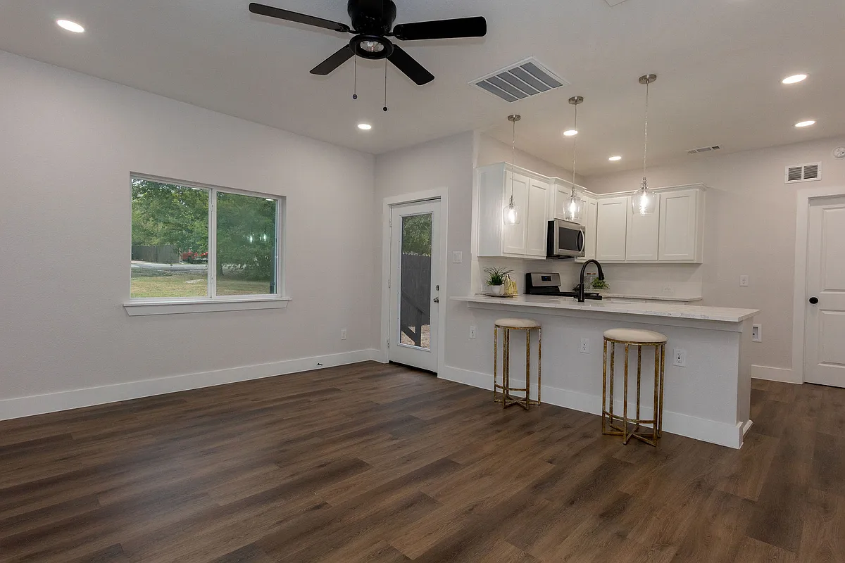 Great Room with breakfast bar, Wifi thermostat, ceiling fan, pendant lighting, exterior back door - 6675 Half Elm St