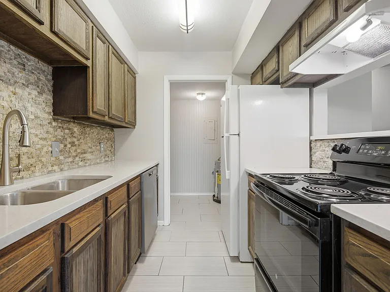 Kitchen Has Tile Floor. Doorway is to Landry Room