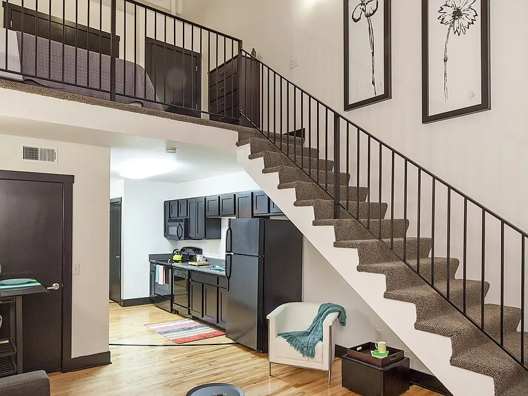 Living room, kitchen and bedroom view at 3 Points Loft.