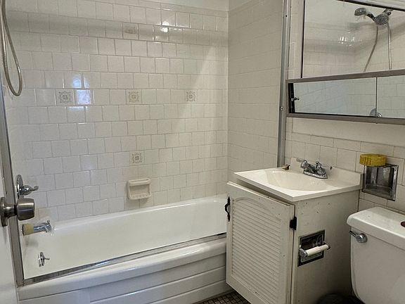 Main bathroom (in hallway, adjacent to master bedroom), glass sliding doors to be installed, medicine cabinet with lots of storage.