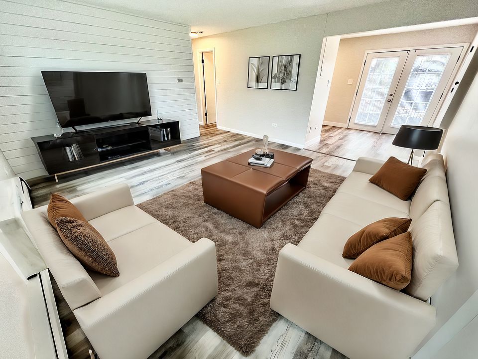 Experience comfort and style in this beautifully designed living room, perfect for relaxation and entertainment.