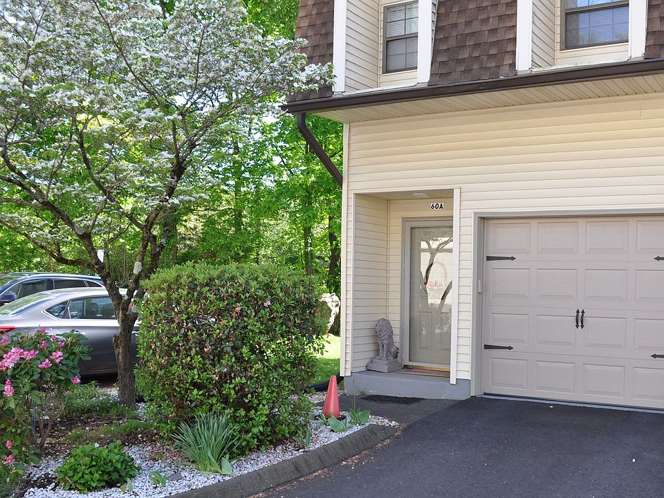 Front entry door with garage door.