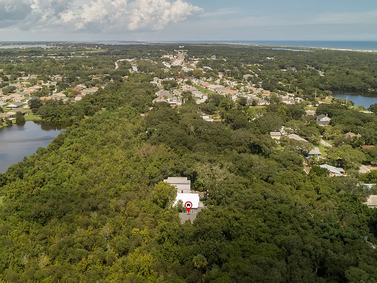 Location is everything. See exactly where your coastal retreat lives_surrounded by lush greenery and peaceful local lakes, offering a quiet sanctuary right by the sea.