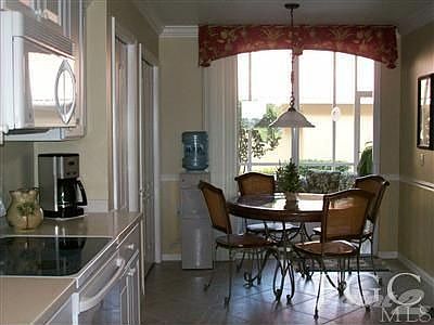 Breakfast area with sliding glass doors to front lanai.