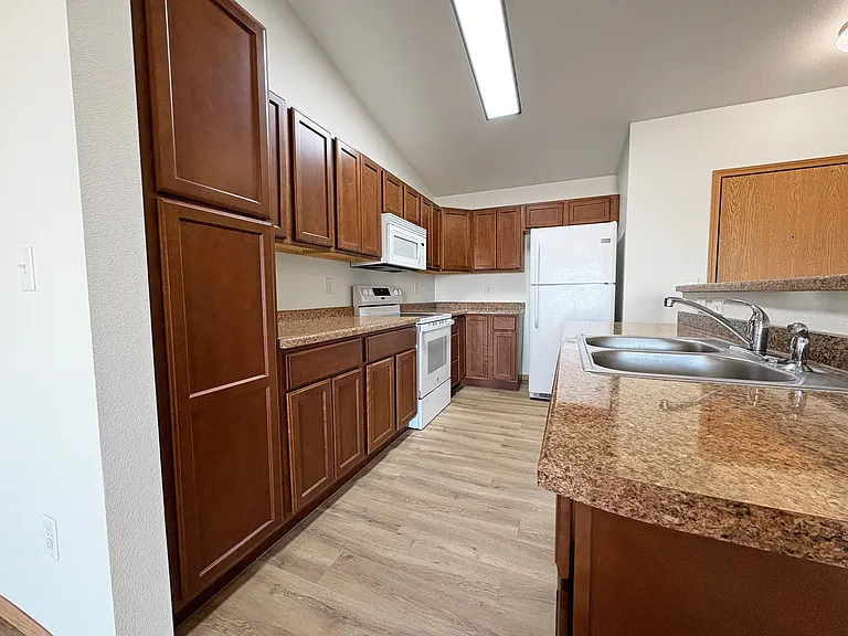 Discover modern living at Gateway Apartments. This stunning kitchen features sleek cabinetry, ample counter space, and top-notch appliances, perfect for your culinary adventures. Don't miss your chance to call this homeschedule a tour today!