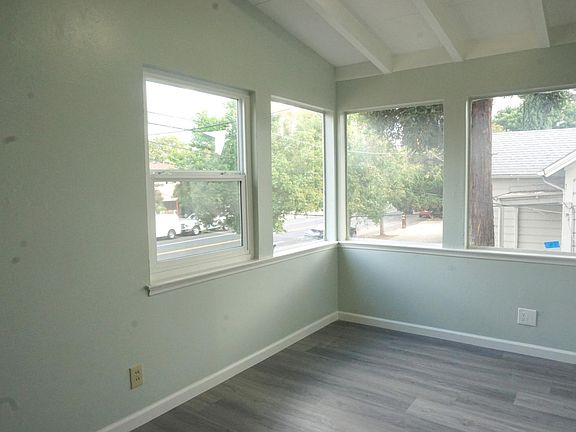 Bright room that can be used a living room, office, or 2nd bedroom