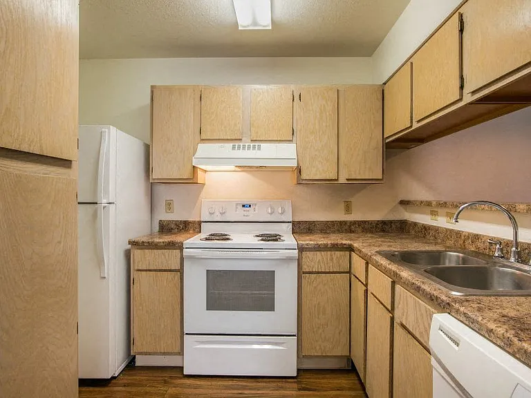 Spacious kitchen with all white appliances