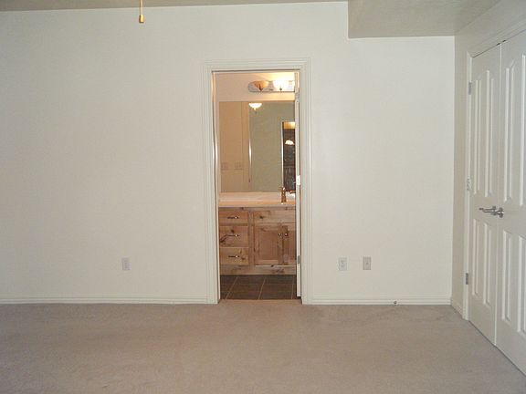 Bedroom looking into bathroom area
