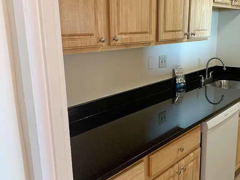 new hardwood cabinets and granite countertops