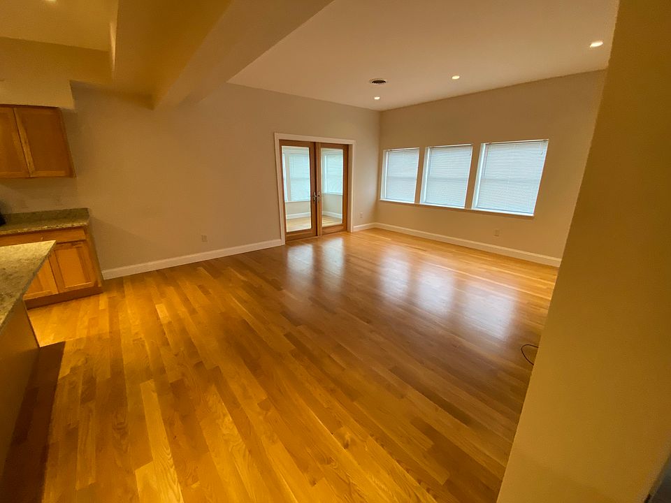 Open Living room and Kitchen, glass doors to 3-season proch