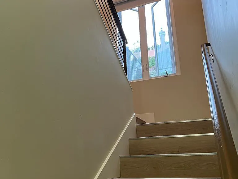 STAIRWAY, 2 BEDROOMS, BATH , LAUNDRY DOWNSTAIRS, MASTER BEDROOM ON SECOND LEVEL. KITCHEN, LIVING AREA, POWDER ROOM,