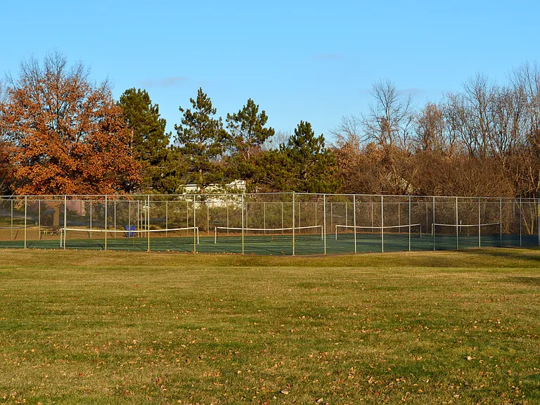 Tennis courts in the park.
