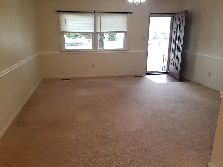 Living room with big front window.
Ceiling Fan and light.
View from dining room.