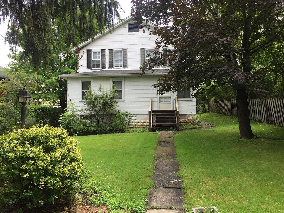 apartment entrance on left side of house