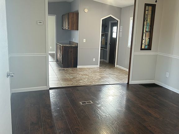 Living Room from door viewing the Kitchen, Dining, and Laundry Room.