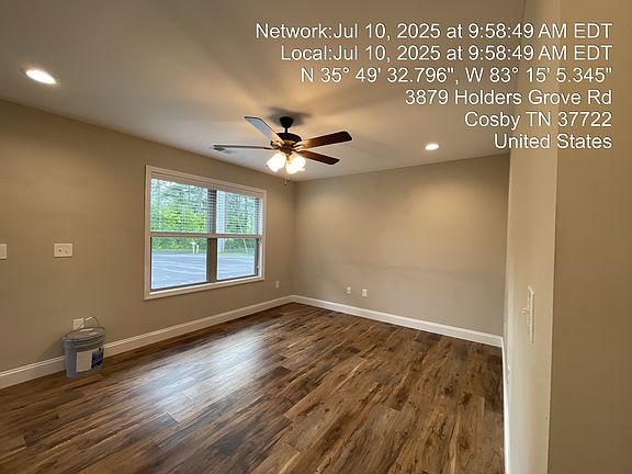 Large living room with double windows and LVP flooring