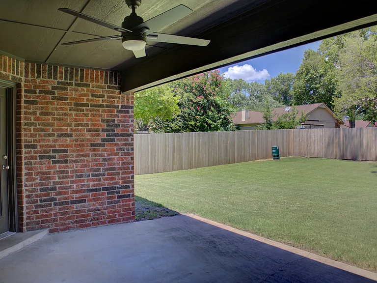 covered back patio w/ fan