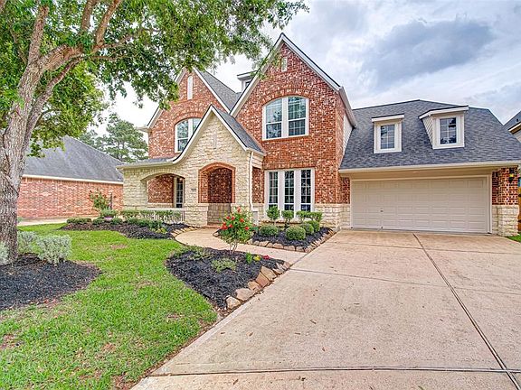 Mature trees and and an inviting front porch give this home so much charm!