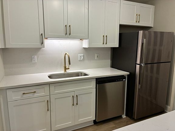 New kitchen with countertops and stainless-steel appliances