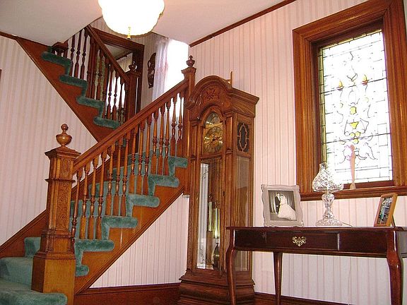 Main Entry-Yesteryear Wood Craftsmanship + Stained Glass -Parquet Under Carpet