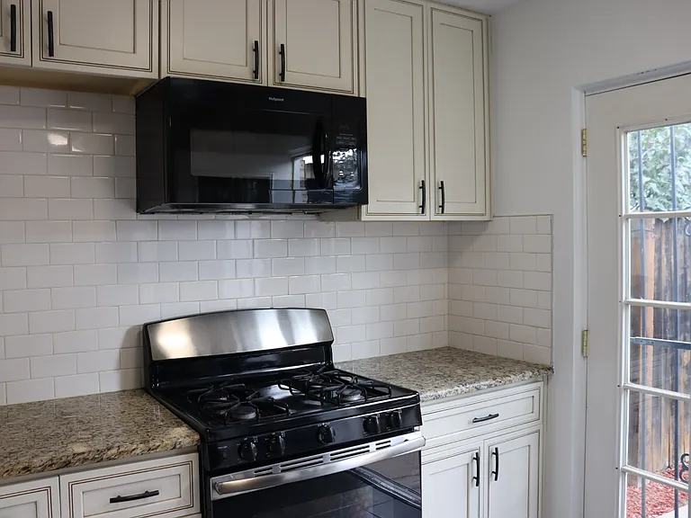 Gas oven & Stove top, Microwave & plenty of cupboard space.