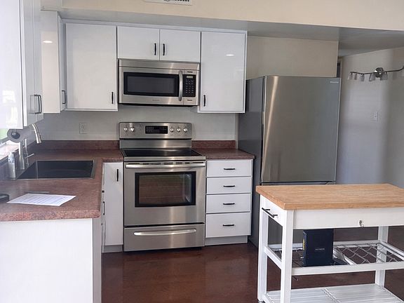 ai enhanced w stainless appliances and all white cabinetry- coming soon