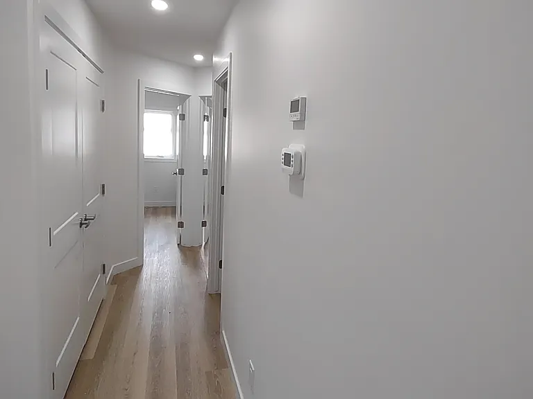 Hallway with Laundry in double door closet