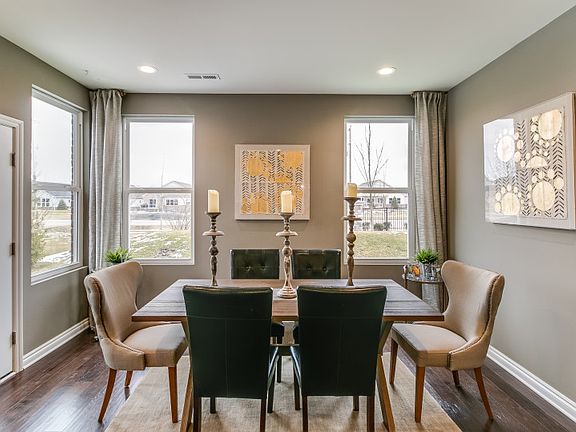 Bright Cafe area featuring a table large enough to provide seating for at six or more.