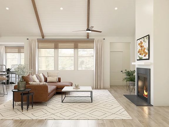 Great room with vaulted ceiling and stained ceiling beams