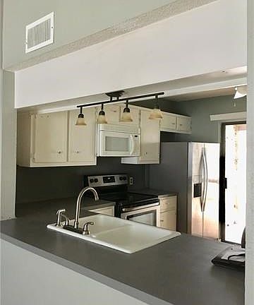 Kitchen opens to living room