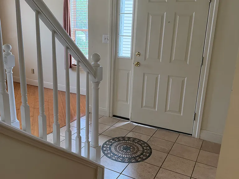 Entry way with tile and bamboo flooring