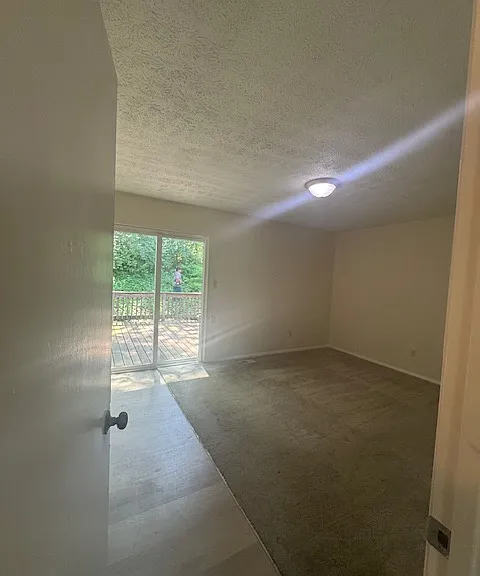 Master Bedroom with sliding glass door to deck in back yard