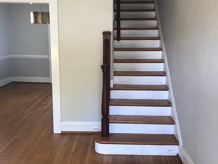 view of stairs from front door/living room