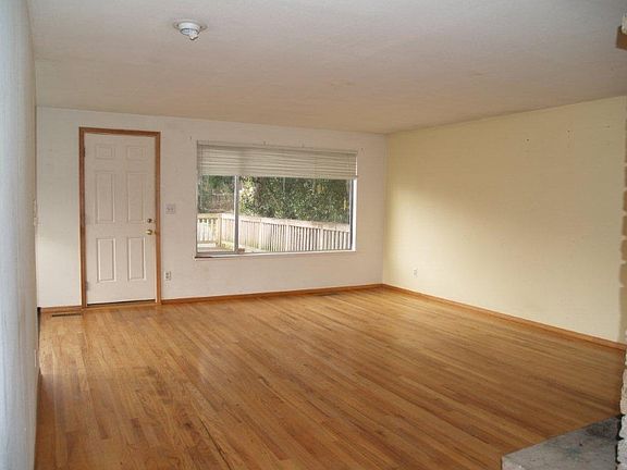 Large stone fireplace in living room