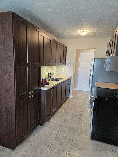Full Kitchen with expanded deep pantry space (front foyer pictured beyond kitchen)