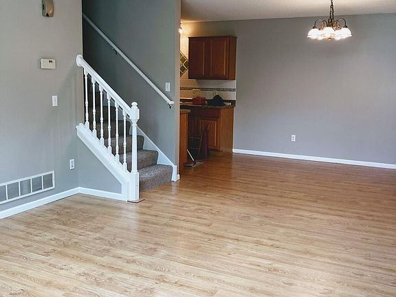Stairs and living dining connected to Kitchen