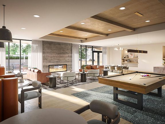 Immerse yourself in the upscale ambiance of our clubroom, where entertainment meets refinement with a pool table, modern kitchen, and chic seating areas.